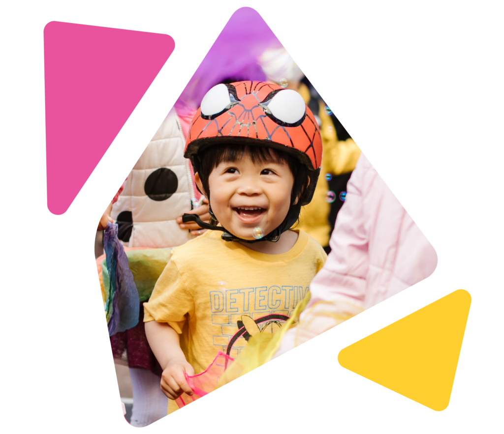 close up on happy toddler outside at street festival